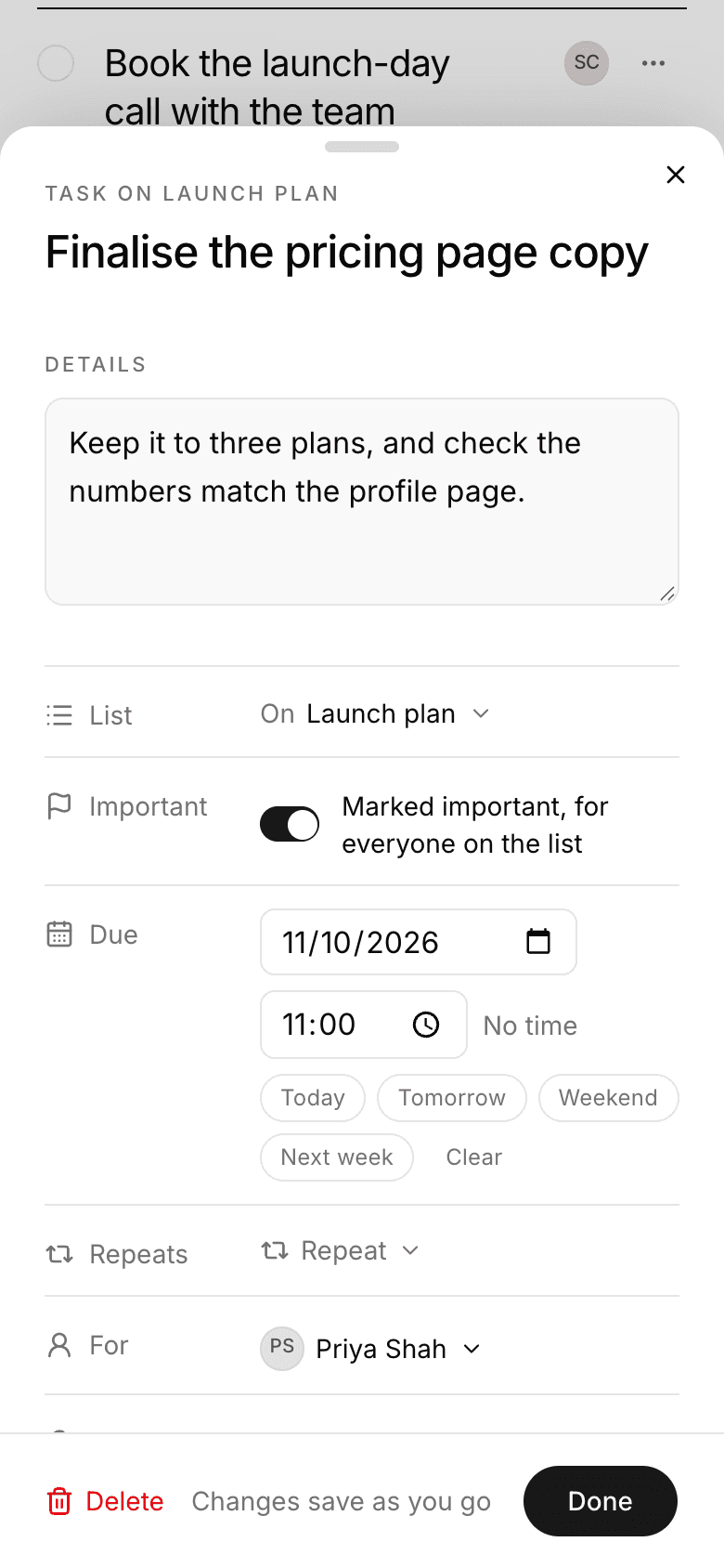 The task Finalise the pricing page copy open on a phone as a sheet from the bottom of the screen, with a small grabber bar at its top.